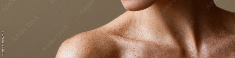 Naklejka premium Close-up of caucasian female neck and shoulder with freckles