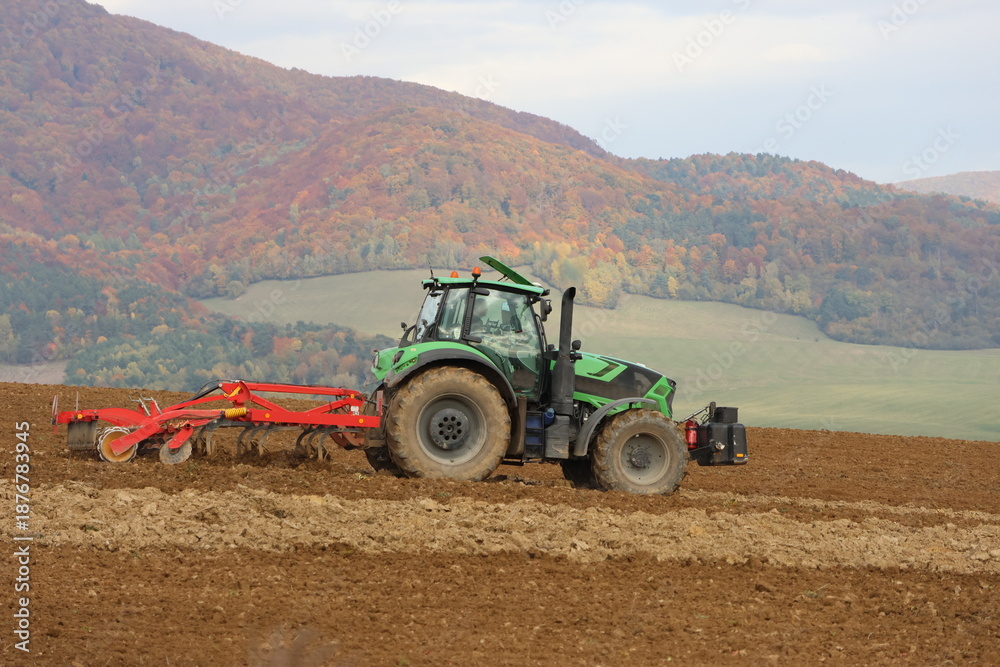 Obraz premium tractor plowing a field