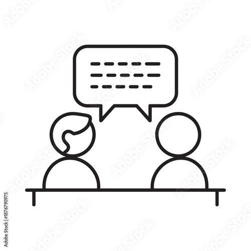 Two people communicating at a table one with a speech bubble