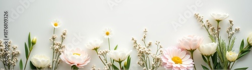 Flowers are arranged in a row on a white surface