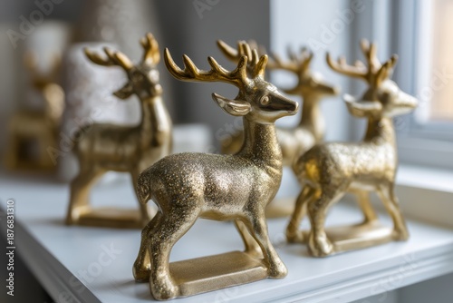 Elegant golden reindeer decorations on a white shelf showcasing festive holiday spirit and seasonal charm in cozy interior design