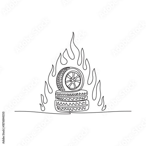 a stack of burning tires with flames rising