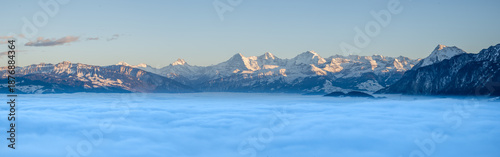Panorama of the Swiss alps over the fog