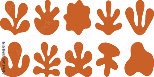 Orange abstract flower shapes arranged in a circular pattern on white background desi
