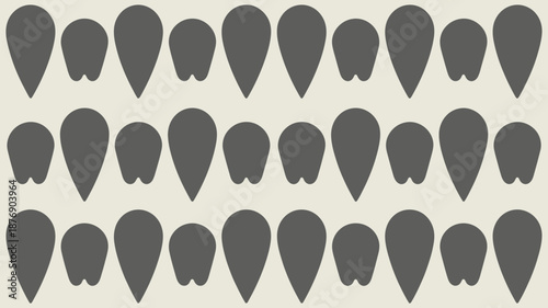 Collection of various gray tooth shapes on beige background