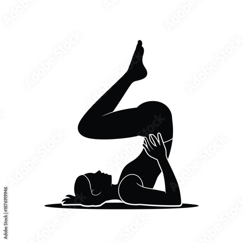 Silhouette of a woman performing a yoga pose focused on flexibility
