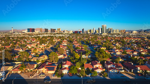 Schilderij op canvas Aerial Las Vegas Suburbs Residential Neighborhood and The Strip at Golden Hour