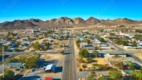 Obraz na płótnie Aerial Beatty Nevada Small Town and Mountain Landscape Under Bright Blue Sky