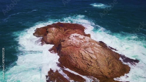 Drone footage of ocean waves crashing on rocks in South African coast