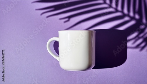 A White Mug Sits On A Purple Surface With A Palm Frond Shadow Minimalist Design