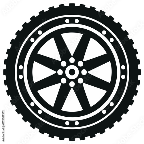 Black silhouette of a vehicle wheel with intricate spokes and textured tire tread