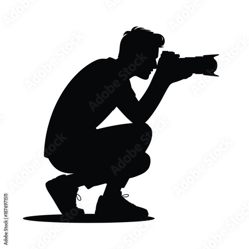 silhouette of a man taking a photo with a camera
