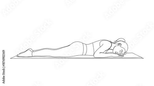 Woman practising yoga in child's pose a relaxing and restorative posture on a mat