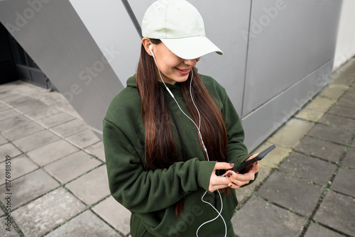 Young woman in khaki sports...