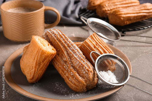Tasty eclairs with sieves, ...