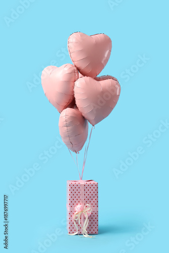 Heart-shaped balloons and g...