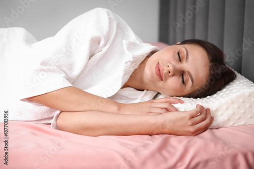 Konstfotografi Young woman sleeping on bed with orthopedic pillow at home