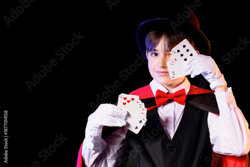 Little magician with playin...