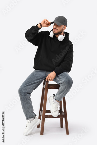 Young man in black hoodie w...