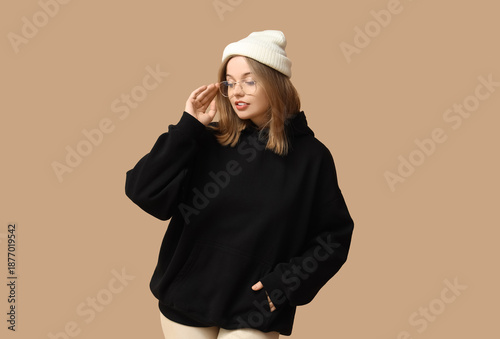 Young woman in black hoodie...