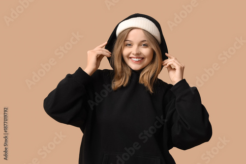 Young woman in black hoodie...