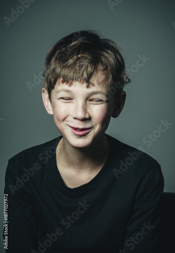 portrait of a surprised smiling boy