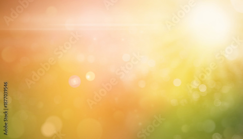 Abstract blurred sunny background with soft yellow, orange, and green tones. Bright bokeh light and warm sunshine create a cheerful and dreamy summer or autumn atmosphere