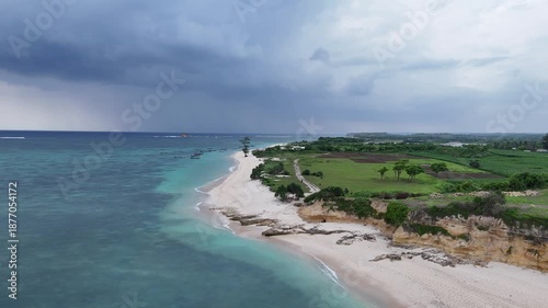Wallpaper Mural Aerial View of Tropical Coastline with White Sand Beach, Turquoise Ocean, and Green Landscape Under Cloudy Sky Torontodigital.ca