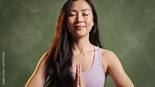 Asian woman practices meditation for stress reduction and healthy mind wellness, promoting mental