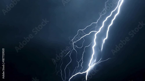 Intense lightning bolt striking through dark storm clouds. A powerful display of nature's electricity and thunder weather for cinematic effects.