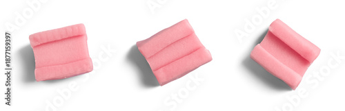 Isolated pink chewing gum pieces