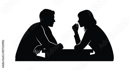 A striking black silhouette of a couple deeply engaged in conversation facing each other silhouette