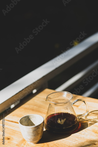 A cup of ice americano in coffee shop.