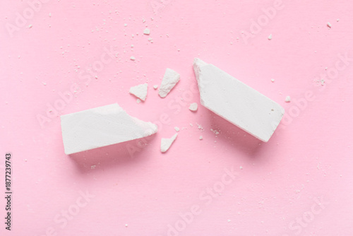 Pieces of white chalk on pi...