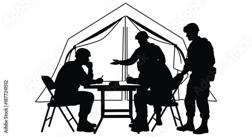 A group of people gathered around a camping table and tent in dark silhouette