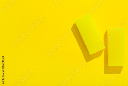 Rubber erasers on yellow ba...