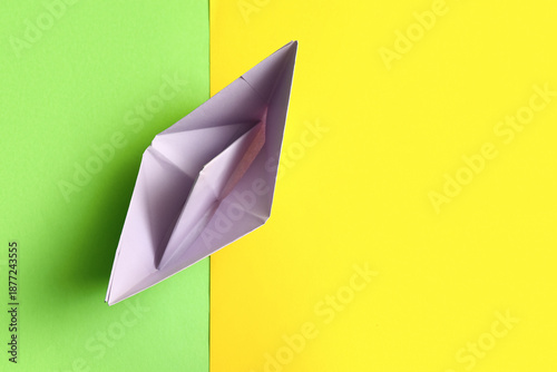 Purple origami boat on colo...