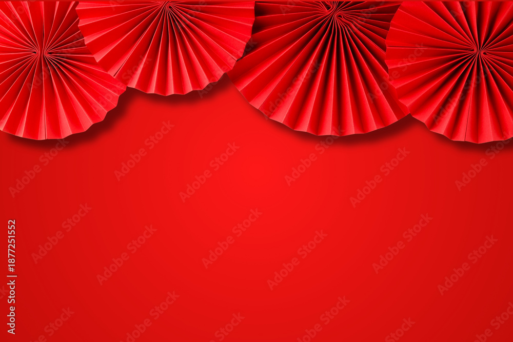 Obraz premium Festive red paper decorations create a joyful background