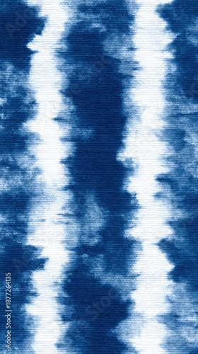 Vertical Blue and White Tie Dye Fabric Texture with Uneven Stripes and Blurred Edges image photo