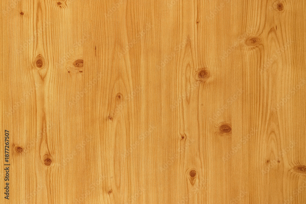 Fototapeta premium Light wooden surface with natural grains and knots as background