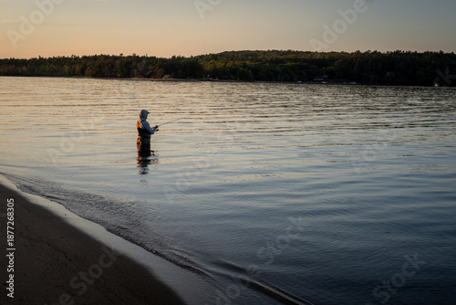 Fotografía Man Fishing at Sunset in Munising Bay, Lake Superior, Upper Peninsula of Michiga