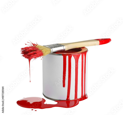Can of red paint with brush...