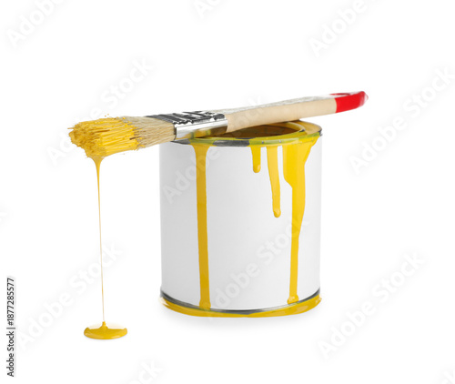 Can of yellow paint with br...
