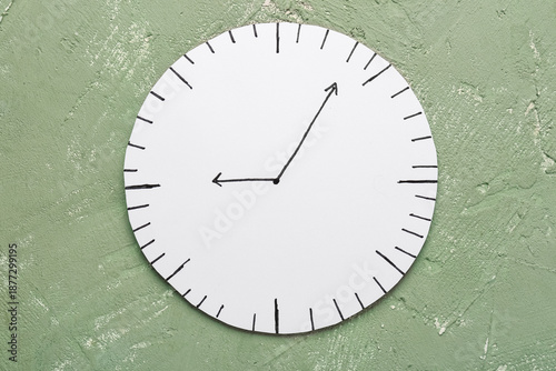 Paper clock on grey backgro...
