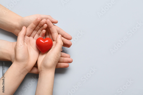 Hands of woman and child wi...