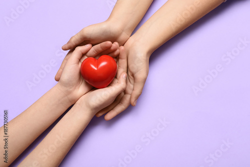 Hands of woman and child wi...