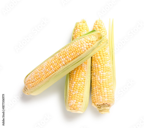 Fresh corn cobs on white ba...