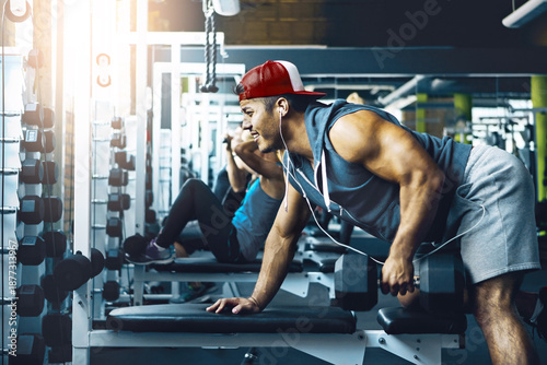 Quadro em tela Intense, dumbbells and man in gym, training and endurance for body development
