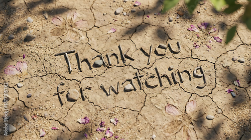 Thank You For Watching Message Spelled Out on Dry Cracked Earth.