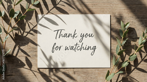 Thank You for Watching Message on Wooden Background with Eucalyptus Leaves.
